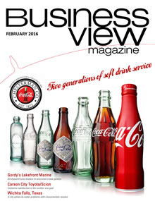 Business View Magazine cover for February 2016, showing a row of coca cola bottles, showing how they have changes over the years.