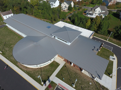 Aerial view of a large metal roofed building.
